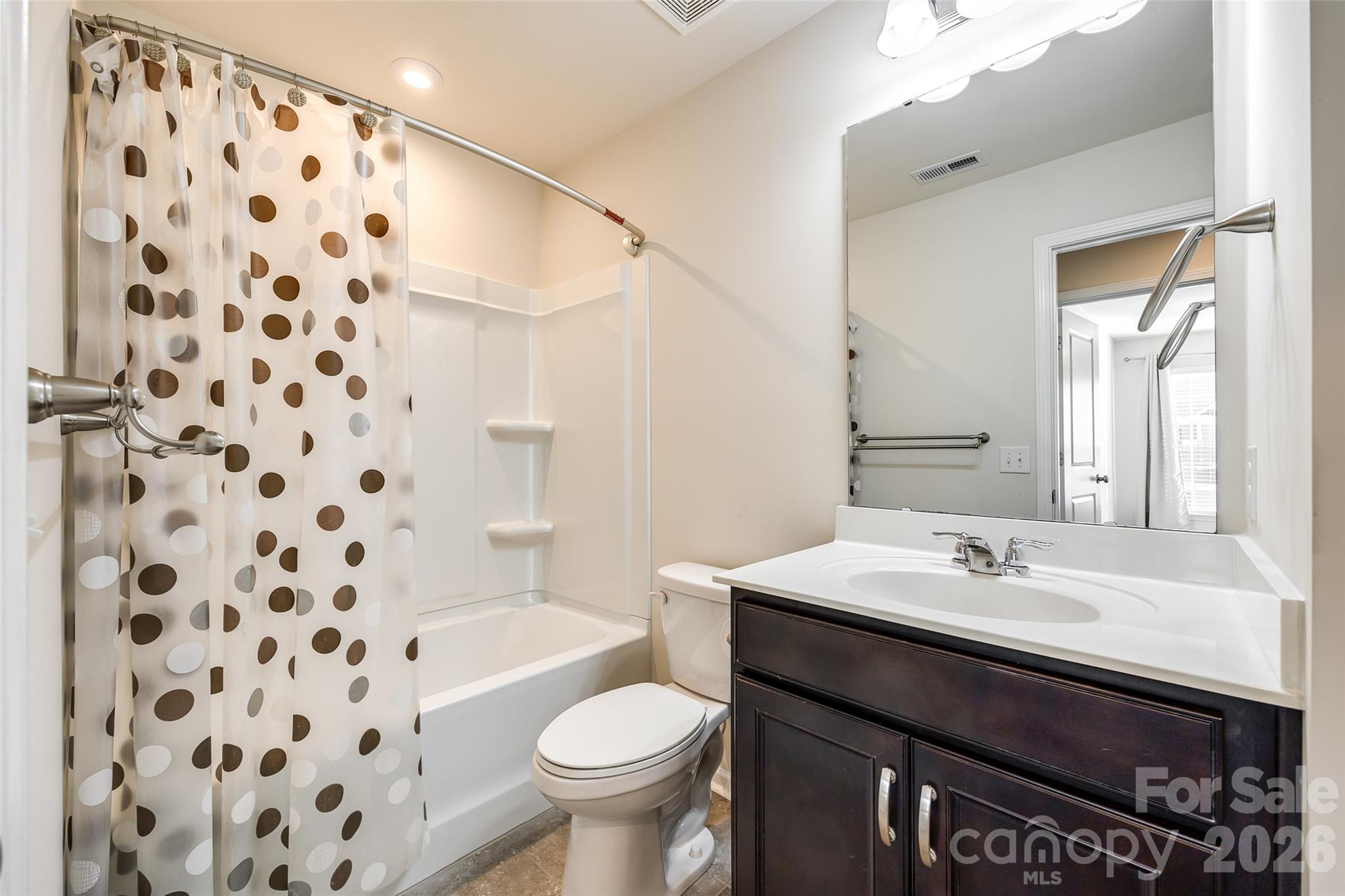 524 Hunters Dance Road Fort Mill, SC 29708 - Photo 26 of 34 a bathroom with a sink a toilet a shower and a mirror