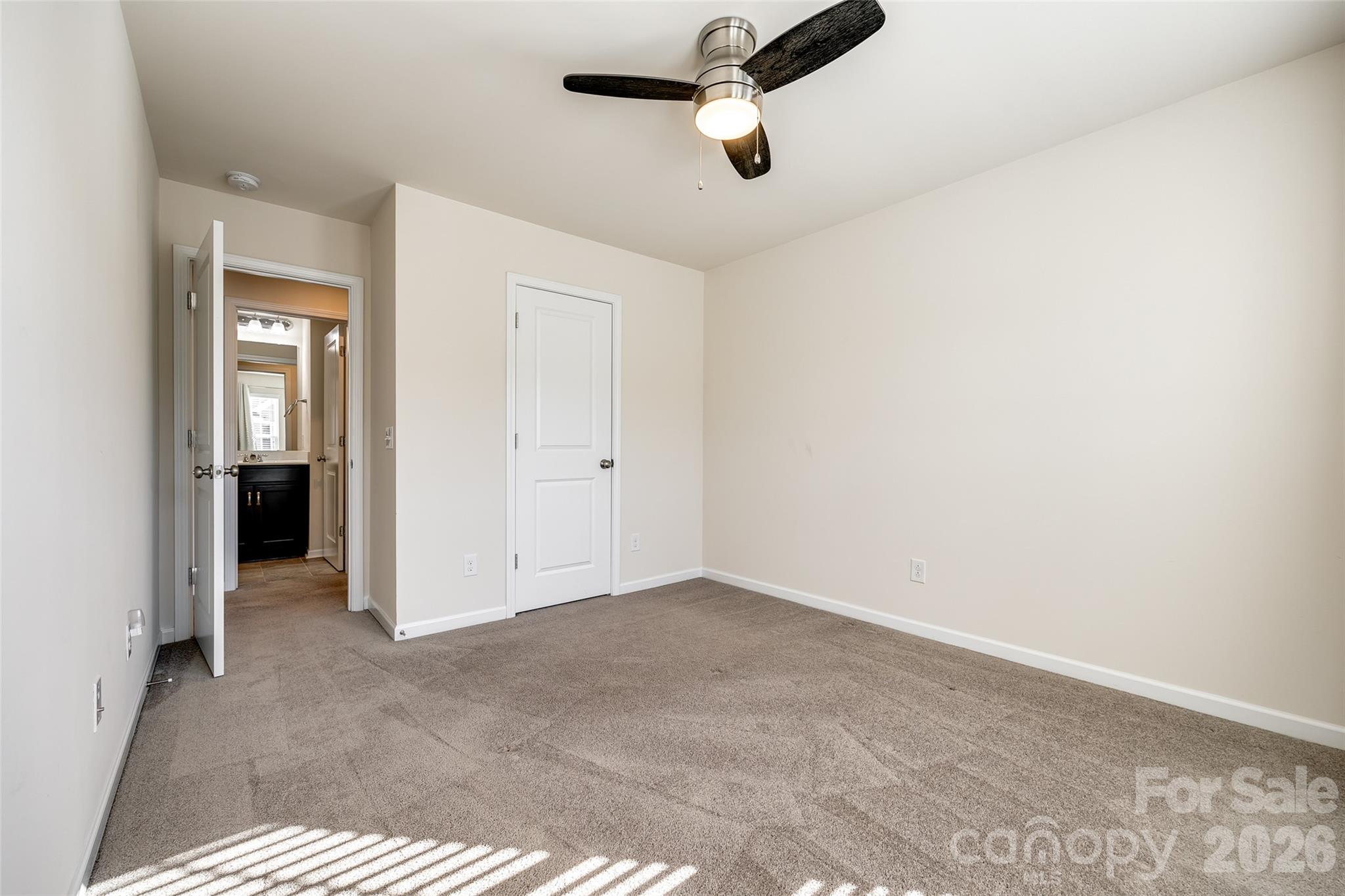 524 Hunters Dance Road Fort Mill, SC 29708 - Photo 27 of 34 an empty room with a ceiling fan and window