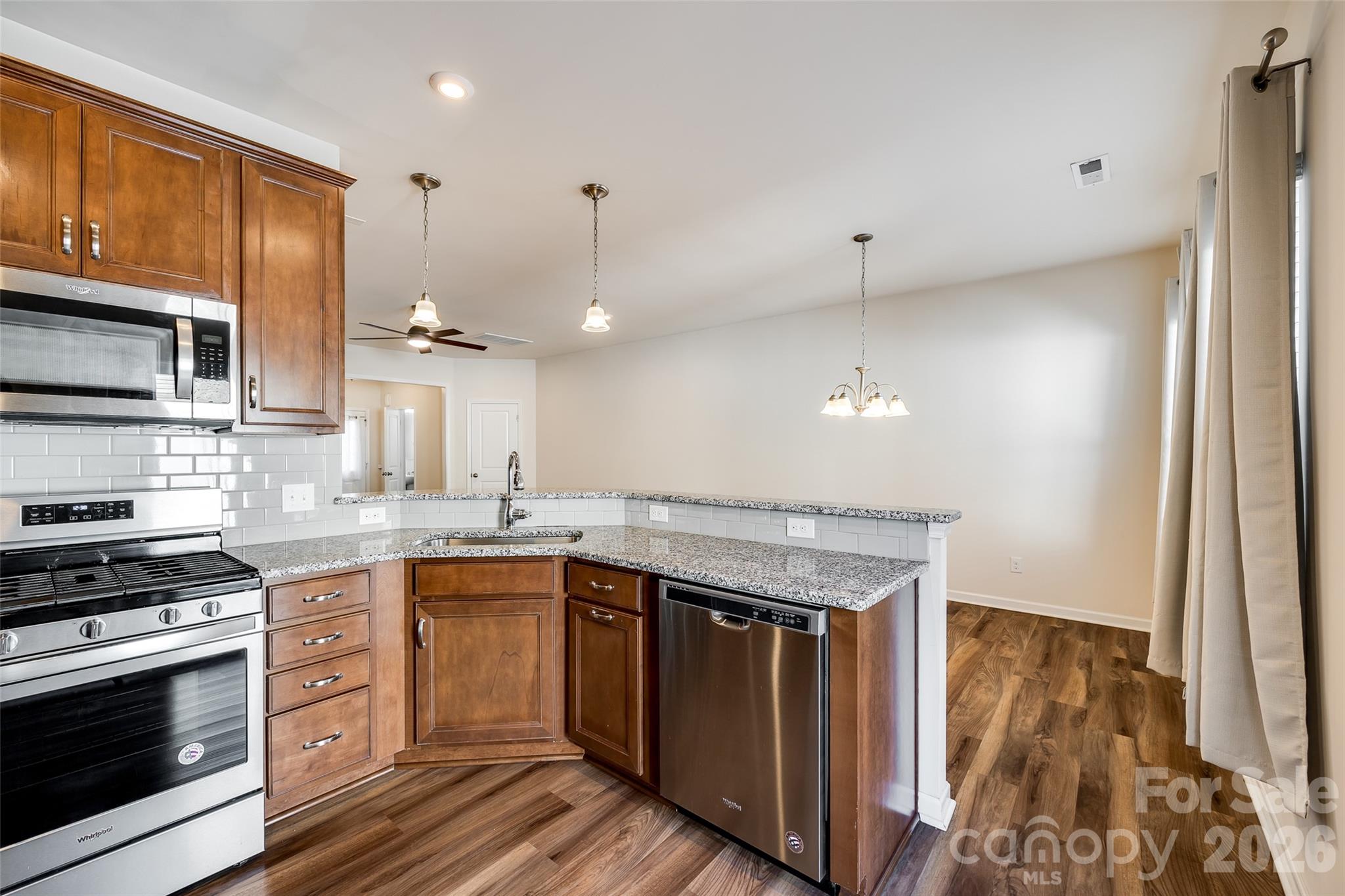 524 Hunters Dance Road Fort Mill, SC 29708 - Photo 4 of 34 a kitchen with a sink stove and microwave