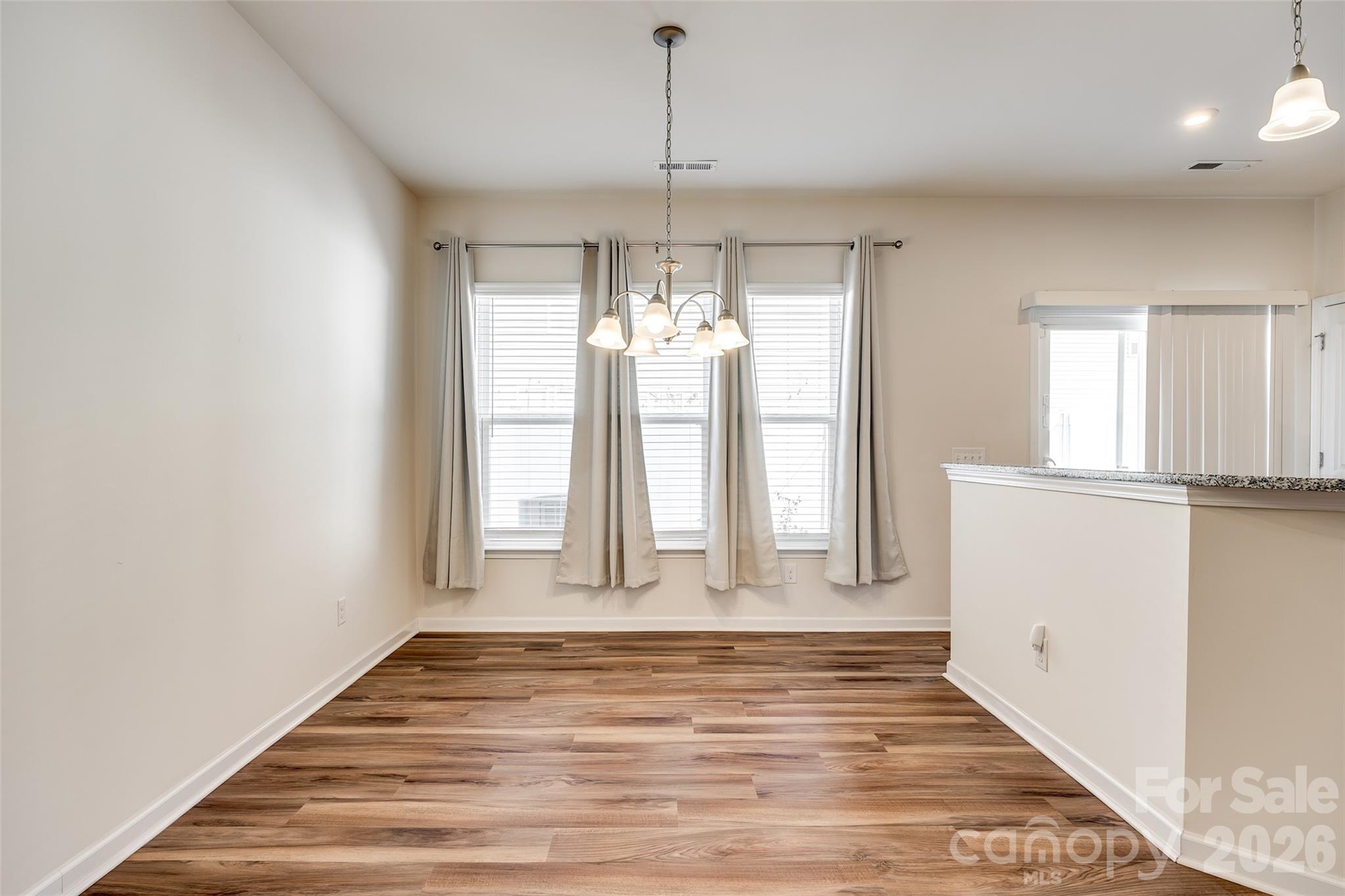 524 Hunters Dance Road Fort Mill, SC 29708 - Photo 7 of 34 a view of empty room with wooden floor and fan