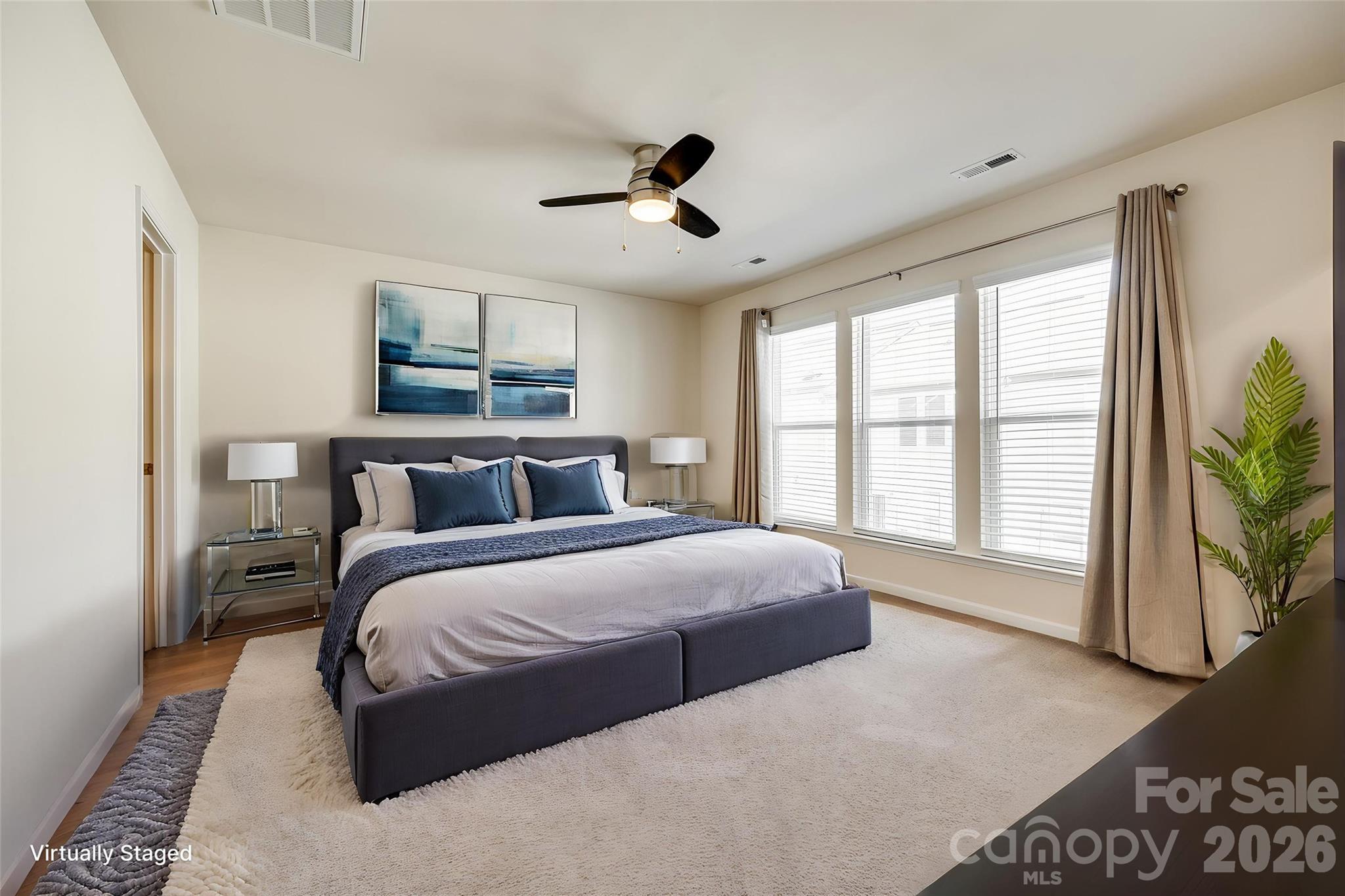 524 Hunters Dance Road Fort Mill, SC 29708 - Photo 8 of 34 a spacious bedroom with a large bed and a large window