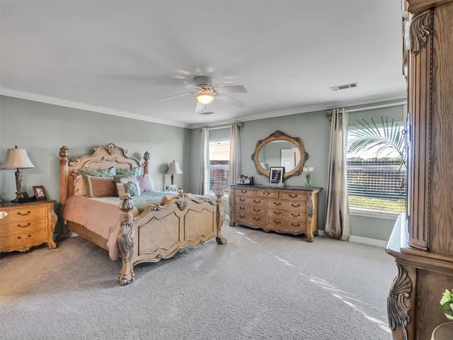 a bed room with a bed and a chandelier