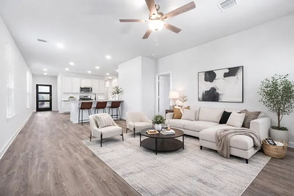 a bathroom with a granite countertop shower sink and vanity