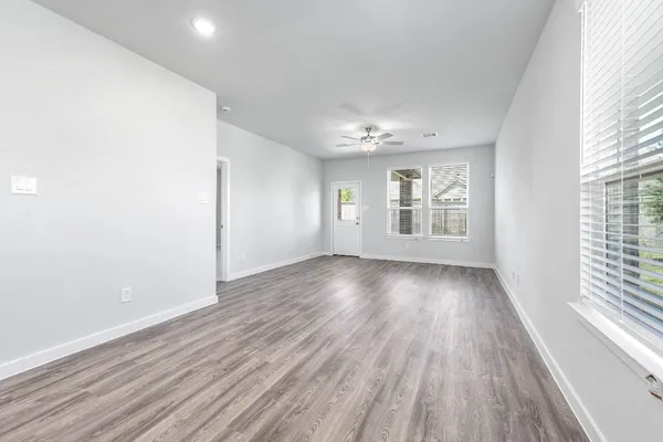 a view of an empty room with a window