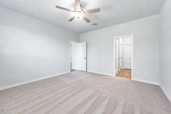 a view of a brick house with a yard