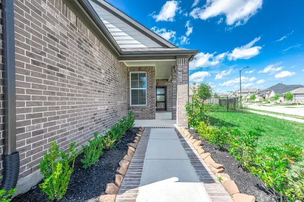 a large kitchen with stainless steel appliances granite countertop a sink and a stove