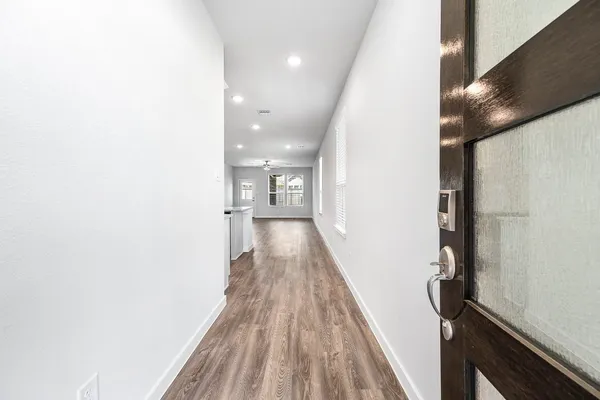 a living room with furniture kitchen view and a dining table