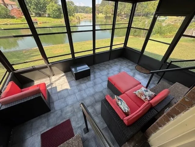 a living room with furniture and a window