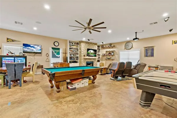 a living room with furniture gym equipment and a flat screen tv