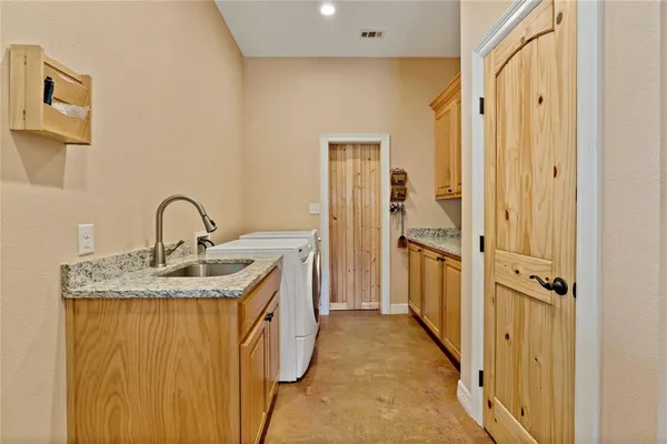 a view of a bathroom with a sink and mirror