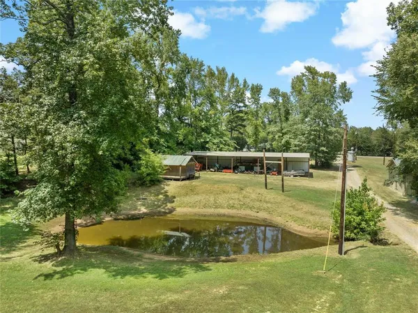 a view of a swimming pool with an outdoor seating area