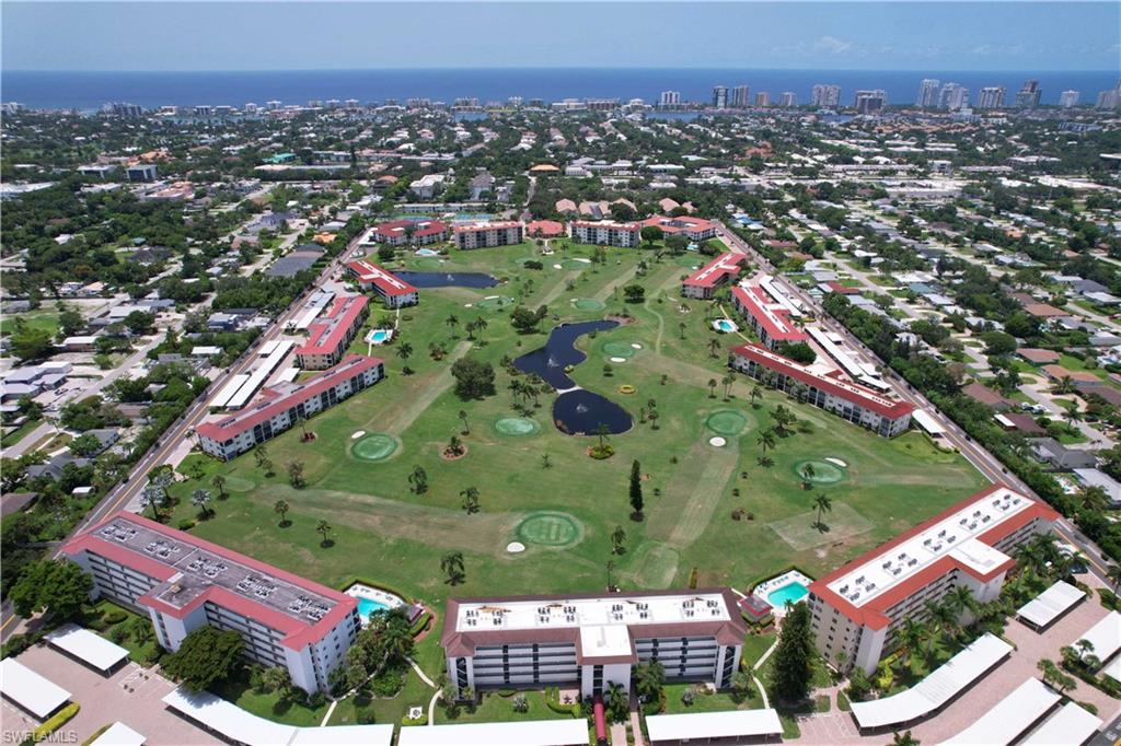 5 High Point Circle West, Unit 313 Naples, FL 34103 - Photo 12 of 24 an aerial view of a city