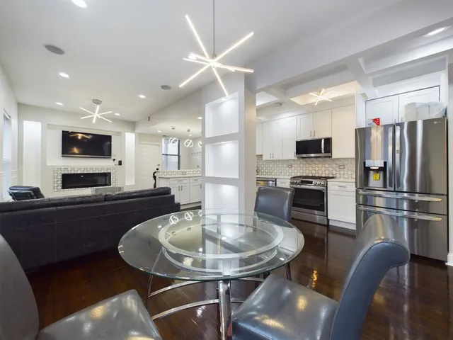 a kitchen with a table and chairs in it