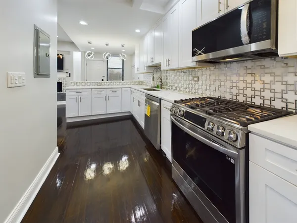 a kitchen with a stove and a microwave
