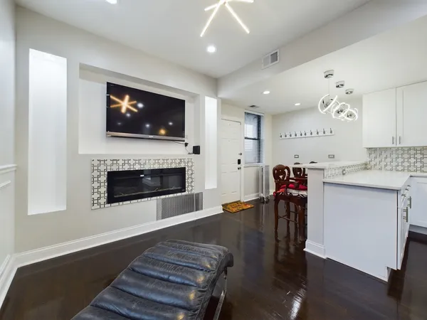 a living room with furniture and a fireplace