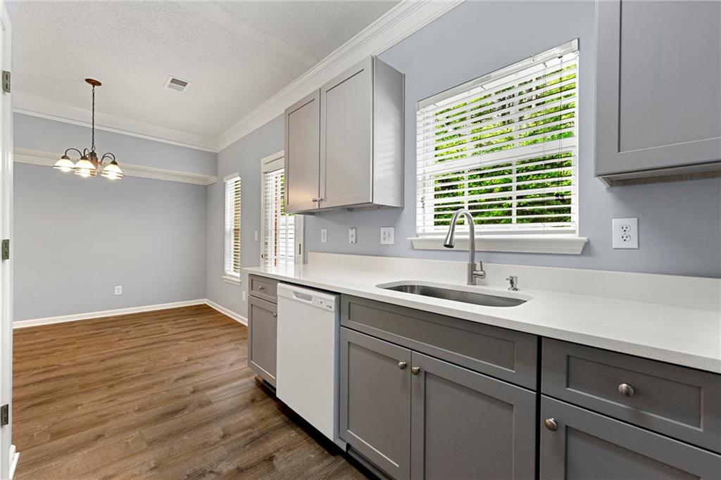 5654 Lawley Road Alpharetta, GA 30022 - Photo 17 of 29 a kitchen with a sink and cabinets