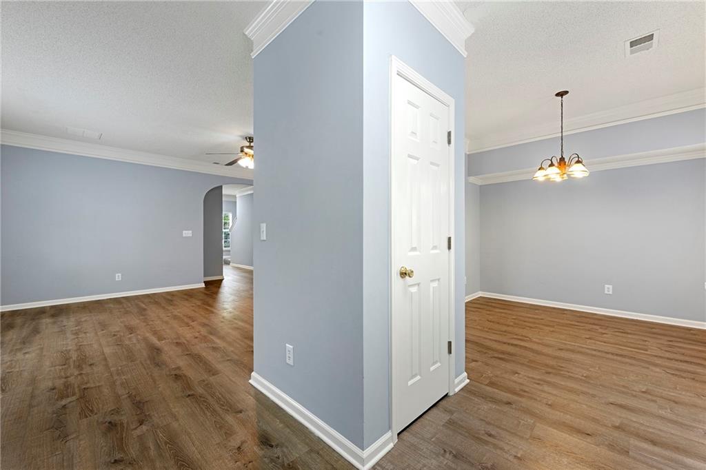 5654 Lawley Road Alpharetta, GA 30022 - Photo 18 of 29 wooden floor in an empty room with a window