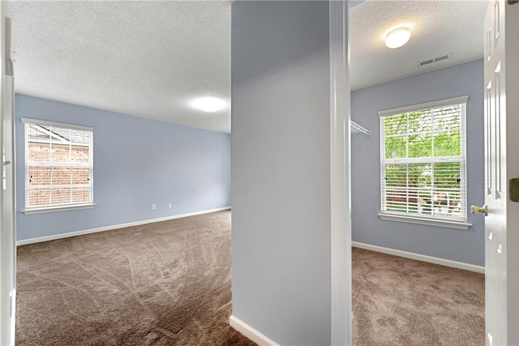 5654 Lawley Road Alpharetta, GA 30022 - Photo 22 of 29 a view of an empty room with a window