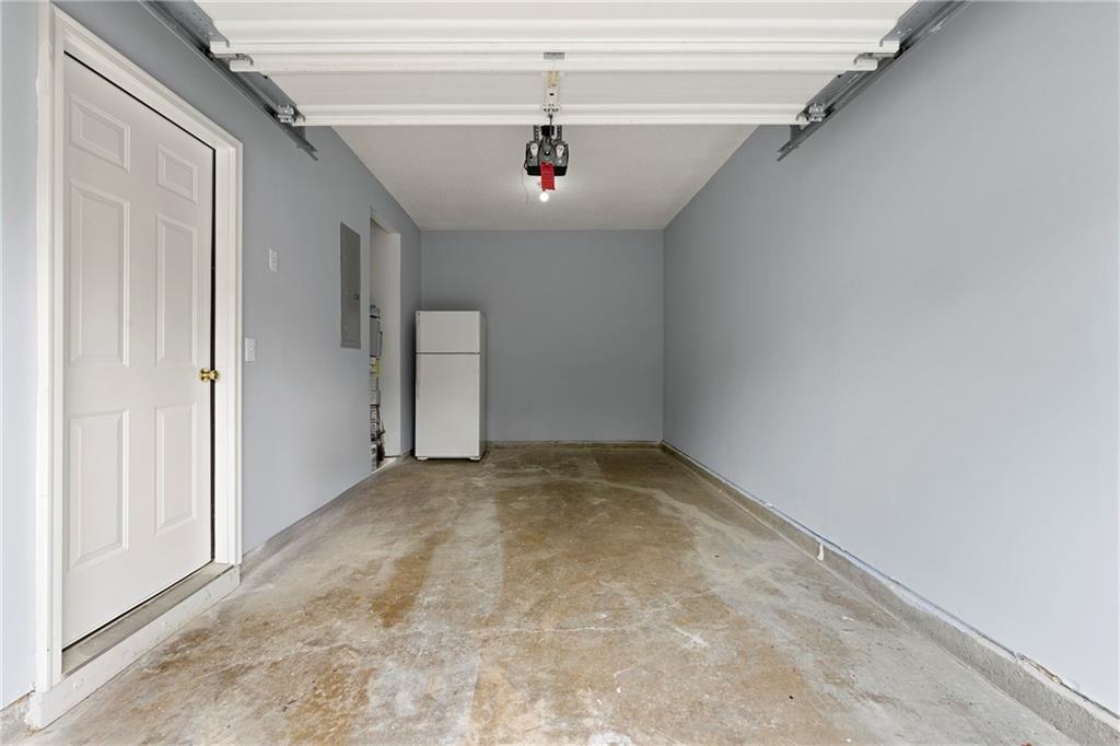 5654 Lawley Road Alpharetta, GA 30022 - Photo 29 of 29 a view of a hallway with a chandelier