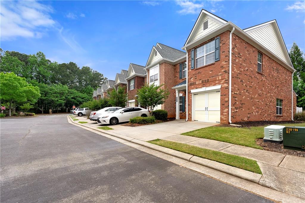 5654 Lawley Road Alpharetta, GA 30022 - Photo 3 of 29 a view of a street with a building in the background