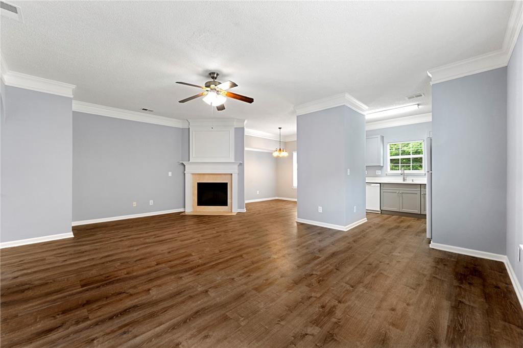 5654 Lawley Road Alpharetta, GA 30022 - Photo 8 of 29 a view of an empty room with a fireplace and a window