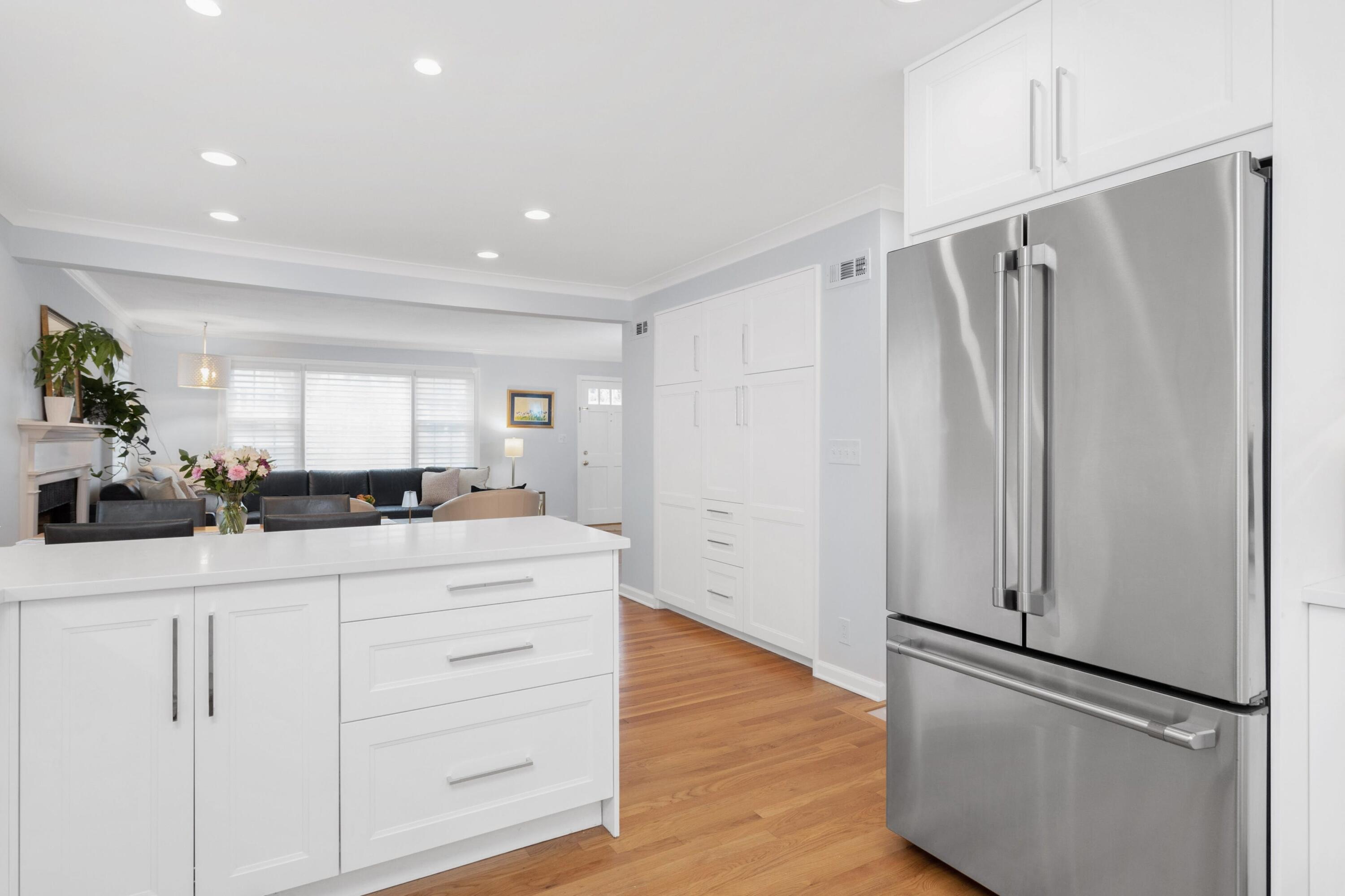 103 Hollow Tree Ridge Road Darien, CT 06820 - Photo 11 of 35 a kitchen with white cabinets and refrigerator