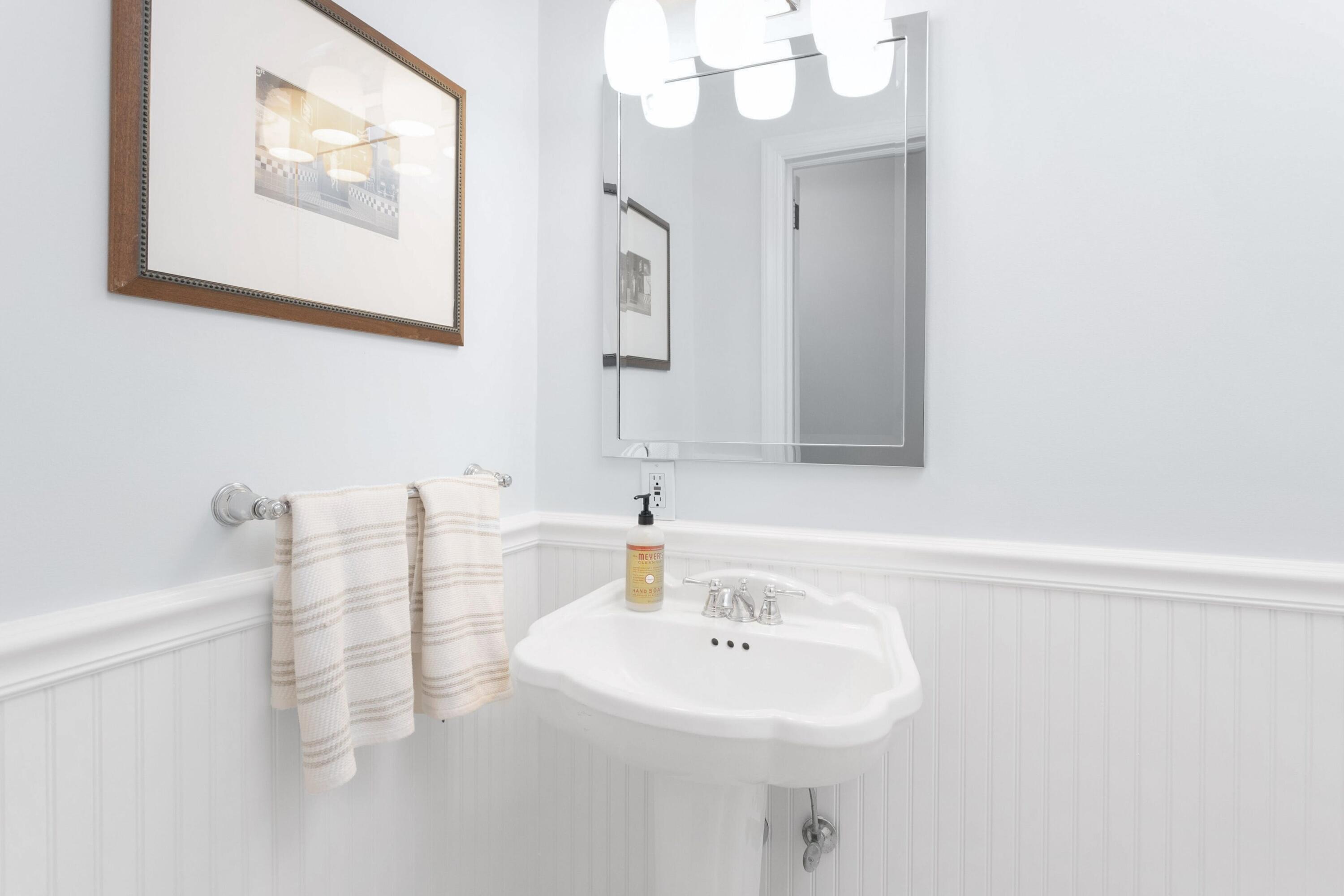 103 Hollow Tree Ridge Road Darien, CT 06820 - Photo 13 of 35 a bathroom with a sink and a mirror
