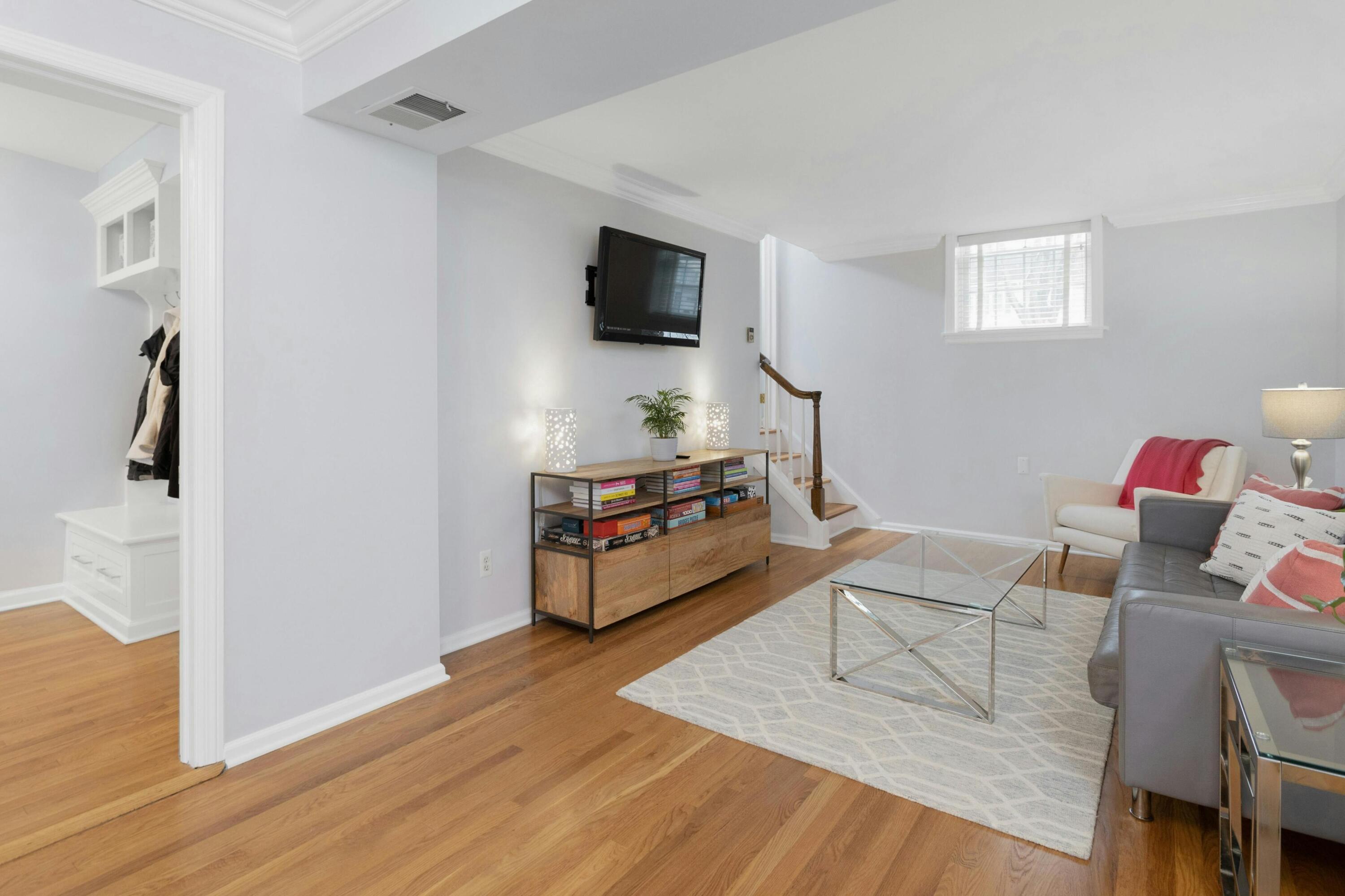 103 Hollow Tree Ridge Road Darien, CT 06820 - Photo 15 of 35 a living room with furniture and a flat screen tv