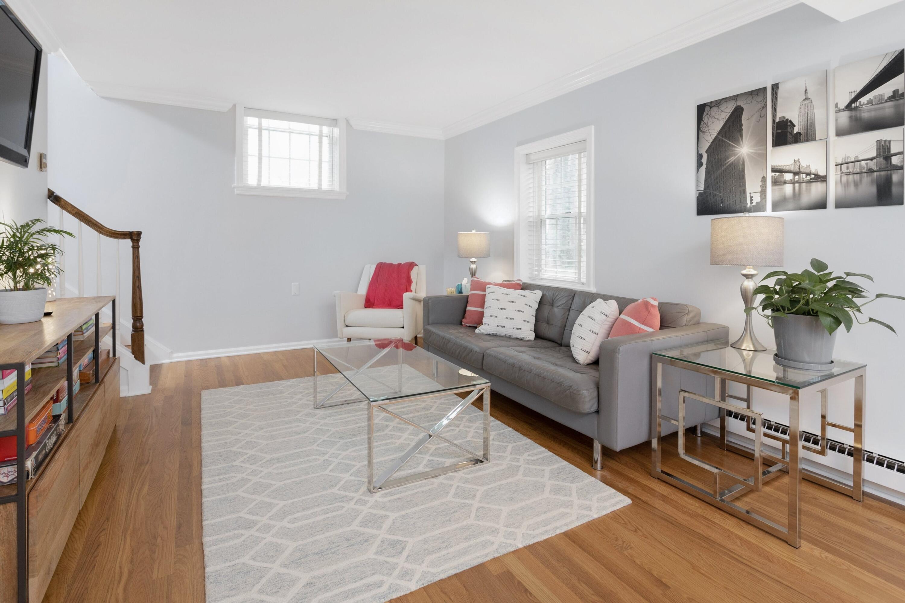 103 Hollow Tree Ridge Road Darien, CT 06820 - Photo 16 of 35 a living room with furniture and a flat screen tv