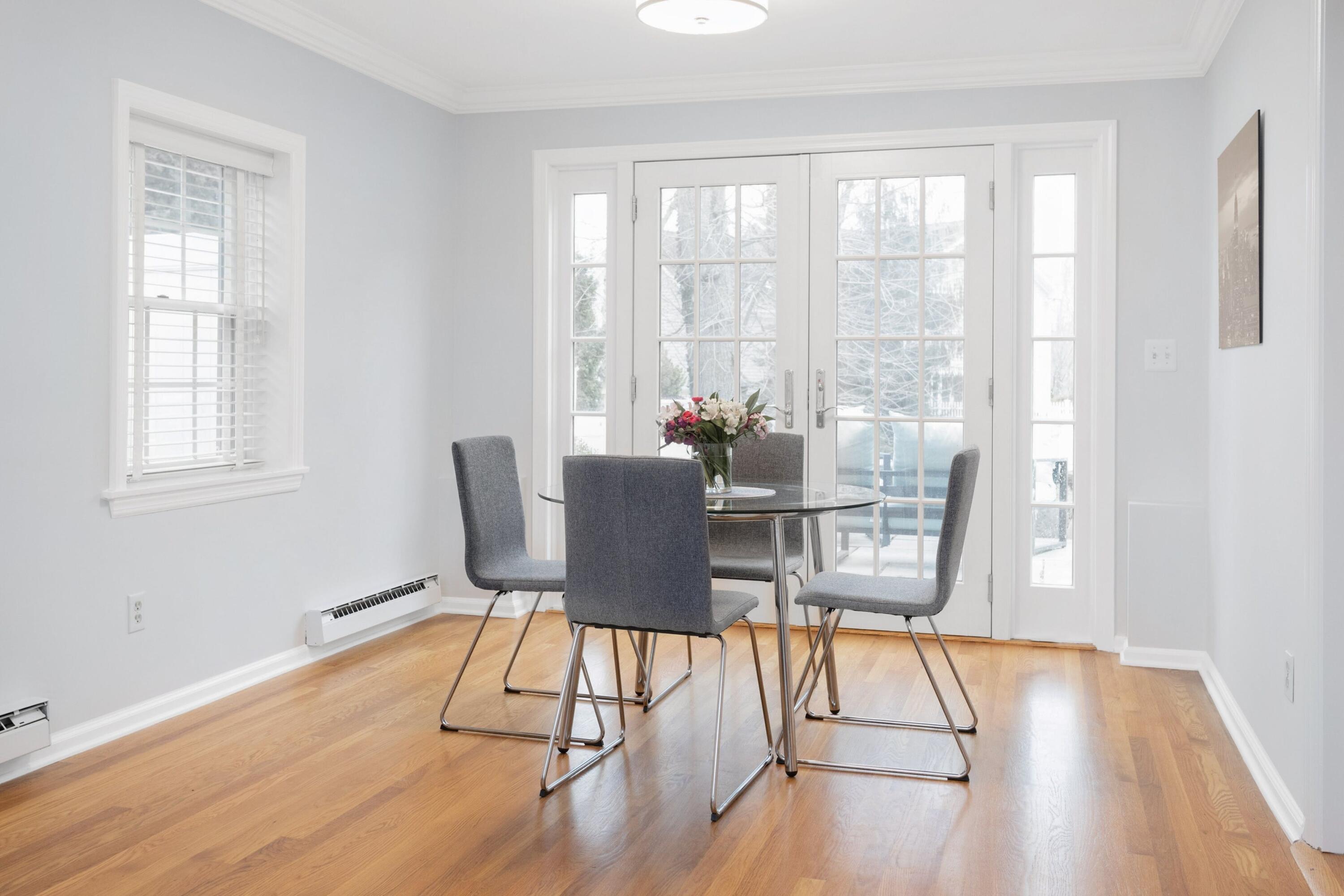 103 Hollow Tree Ridge Road Darien, CT 06820 - Photo 18 of 35 a dining room with wooden floor and a window