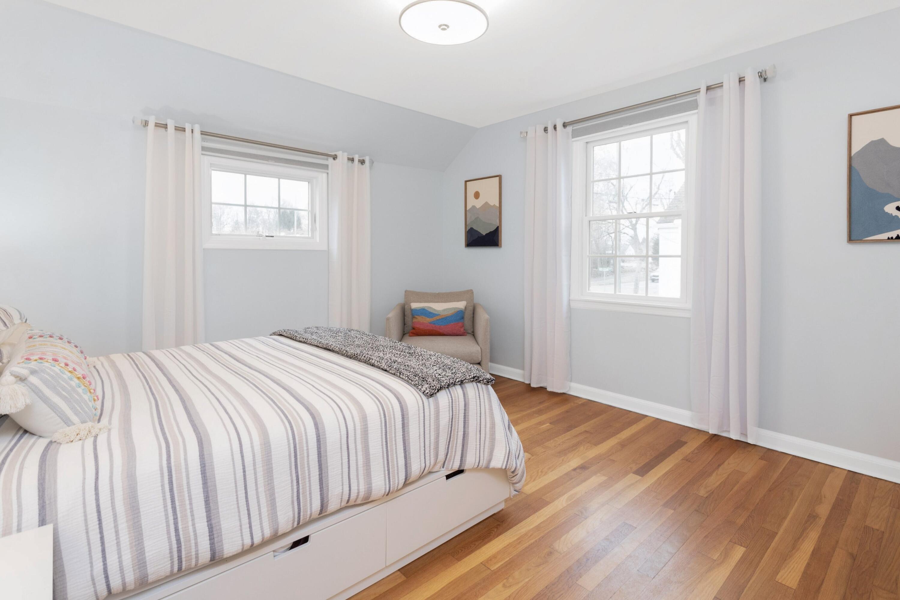 103 Hollow Tree Ridge Road Darien, CT 06820 - Photo 19 of 35 a bedroom with a bed and a window