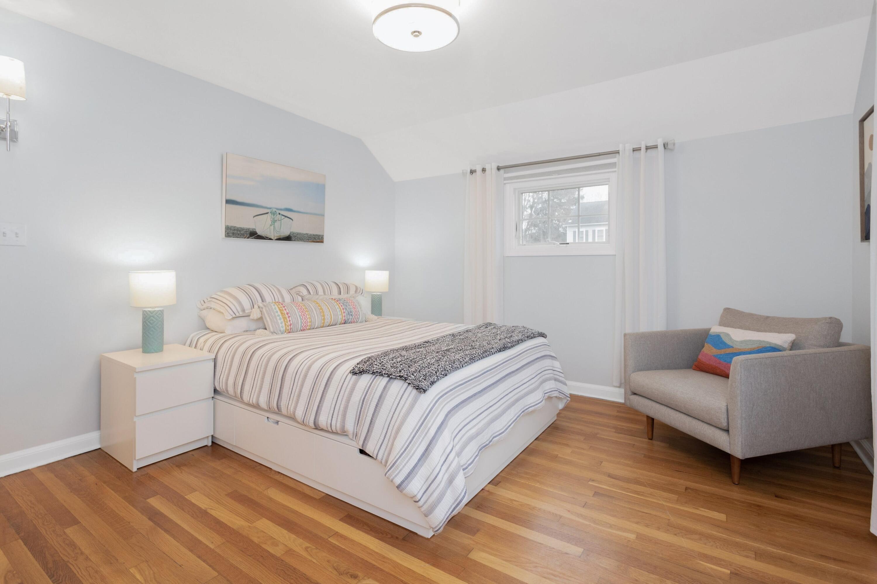 103 Hollow Tree Ridge Road Darien, CT 06820 - Photo 20 of 35 a bedroom with a bed and a couch