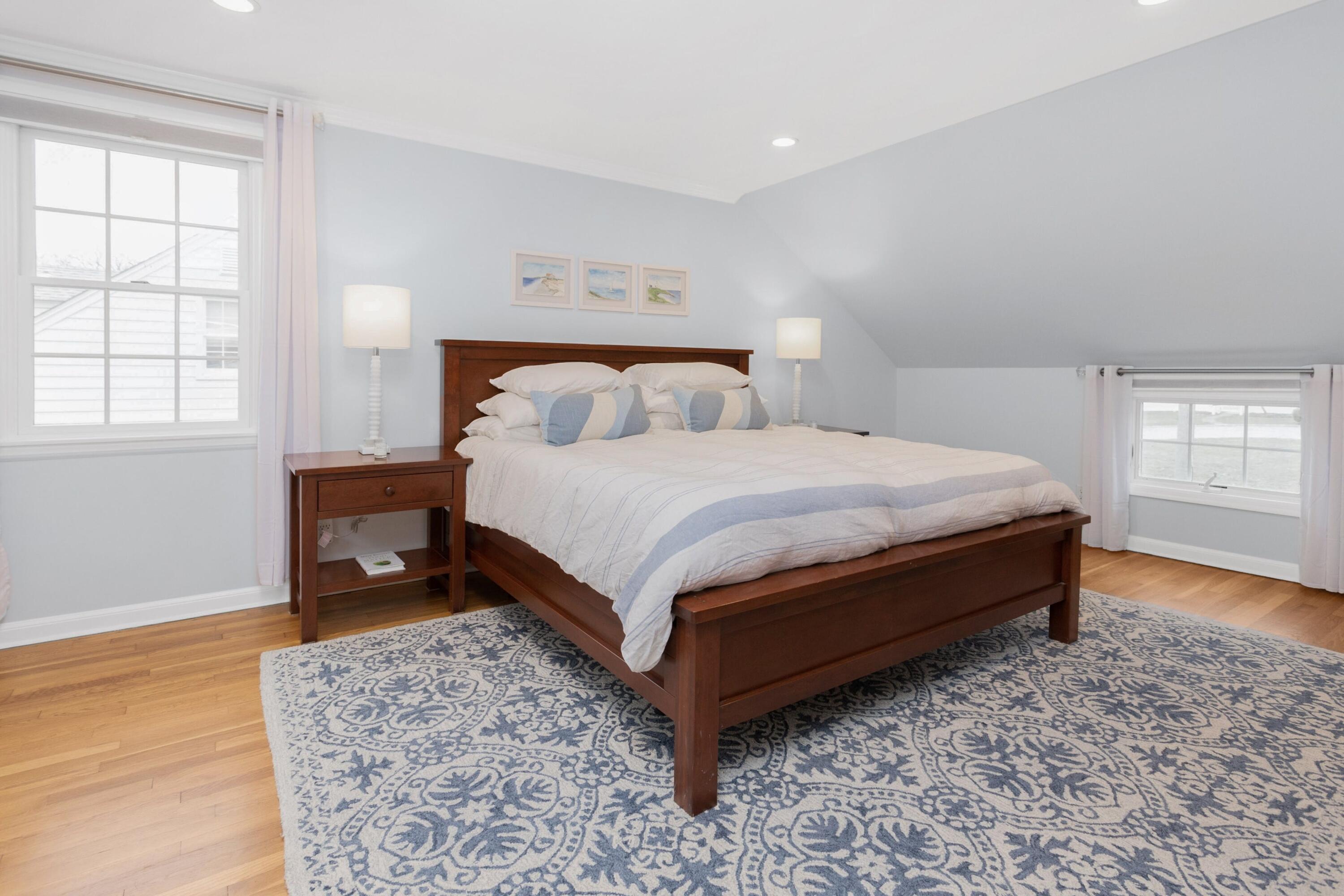 103 Hollow Tree Ridge Road Darien, CT 06820 - Photo 23 of 35 a bedroom with a bed and window