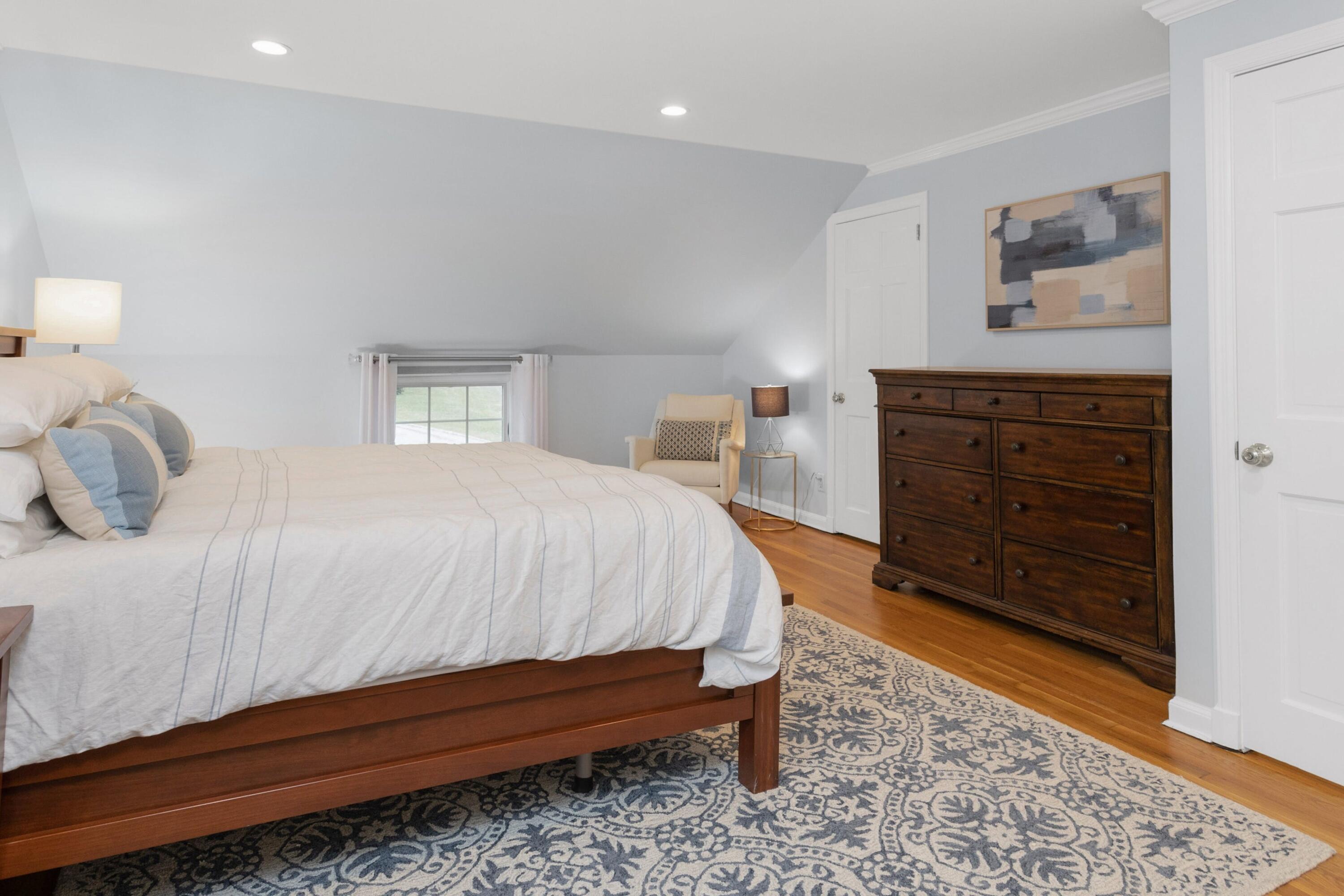103 Hollow Tree Ridge Road Darien, CT 06820 - Photo 25 of 35 a bedroom with a bed and a dresser