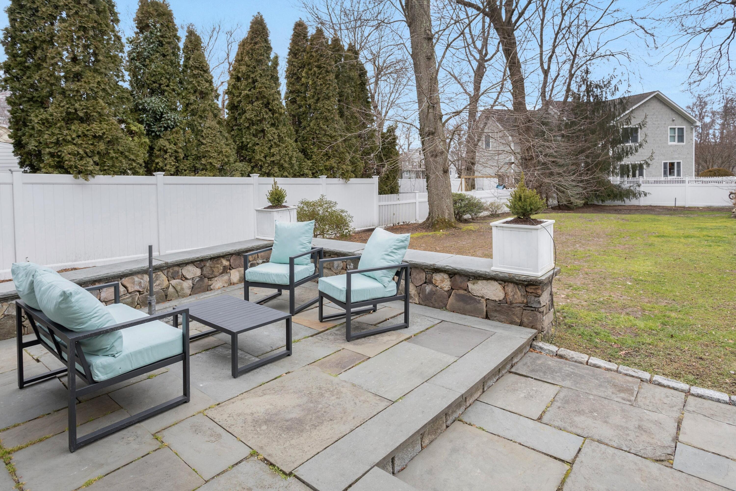 103 Hollow Tree Ridge Road Darien, CT 06820 - Photo 31 of 35 a terrace of a house with outdoor seating