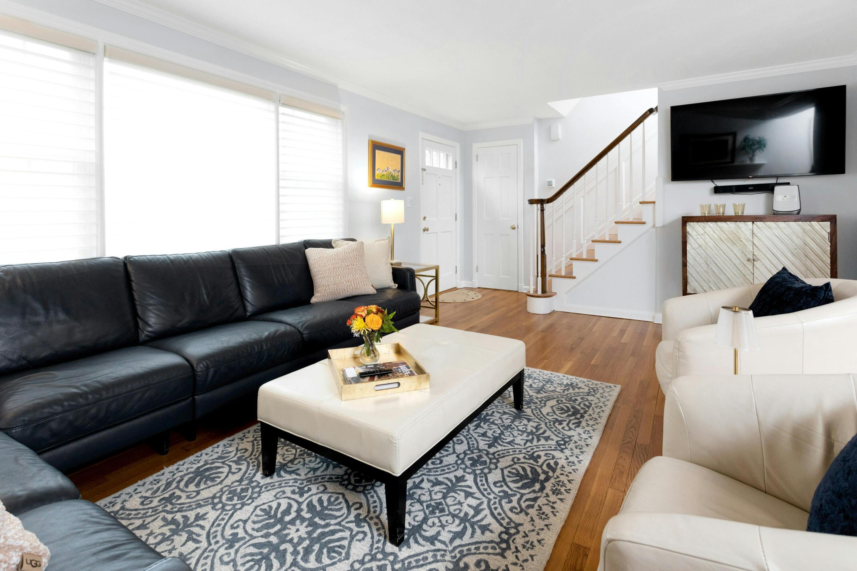 103 Hollow Tree Ridge Road Darien, CT 06820 - Photo 5 of 35 a living room with furniture and a flat screen tv