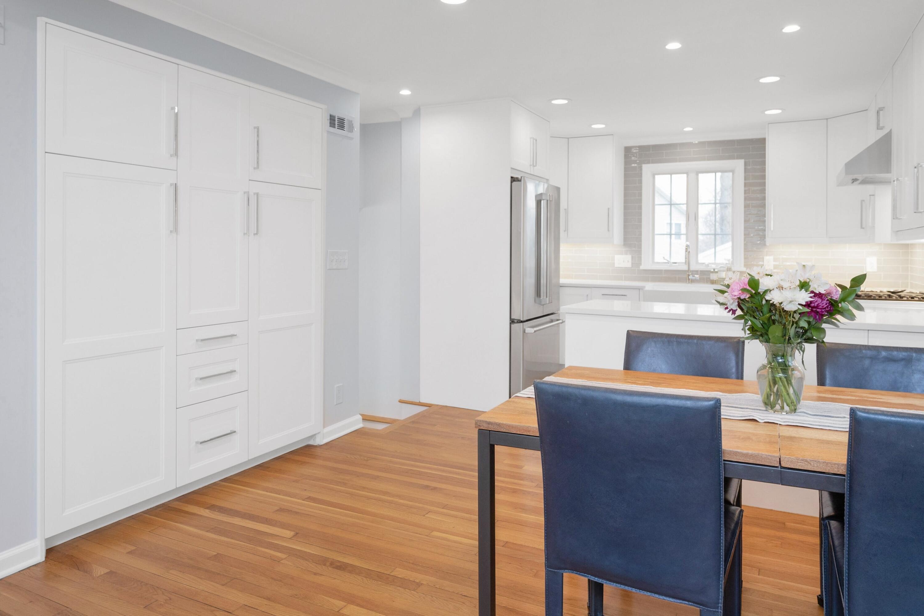 103 Hollow Tree Ridge Road Darien, CT 06820 - Photo 9 of 35 a room with a refrigerator and a potted plant