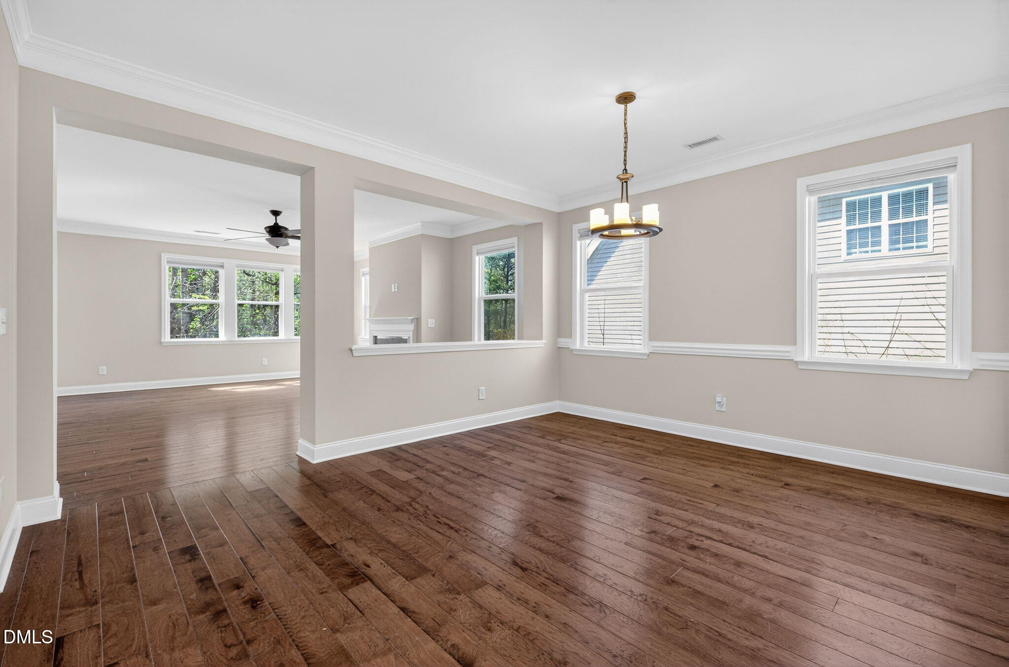 1304 Barnford Mill Road Wake Forest, NC 27587 - Photo 8 of 44 a view of an empty room with wooden floor and a window