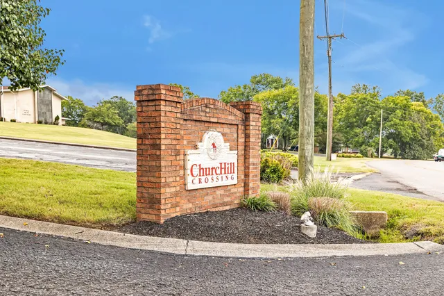 a sign board on the side of a road