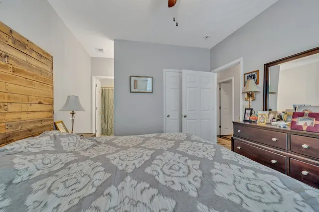 a bedroom with a bed and a dresser