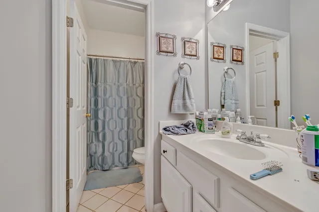a bathroom with a sink vanity and a mirror