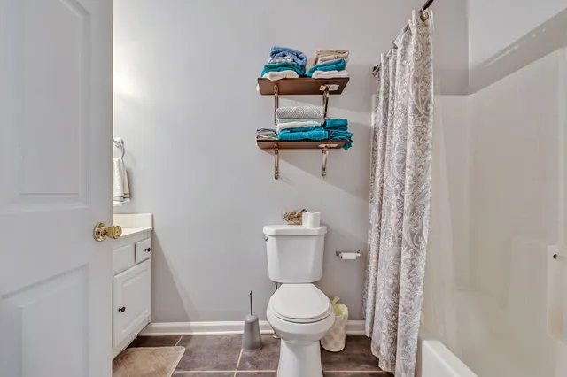 a bathroom with a toilet and a sink