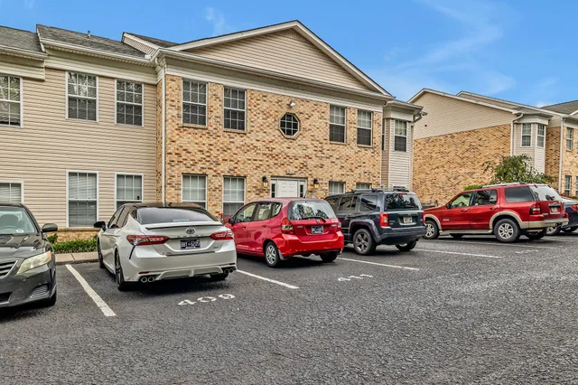 a view of a car parked in front of a house