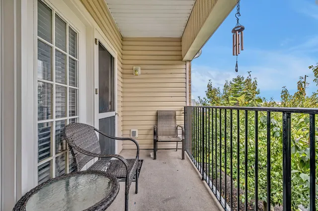 a view of a chair and table in balcony