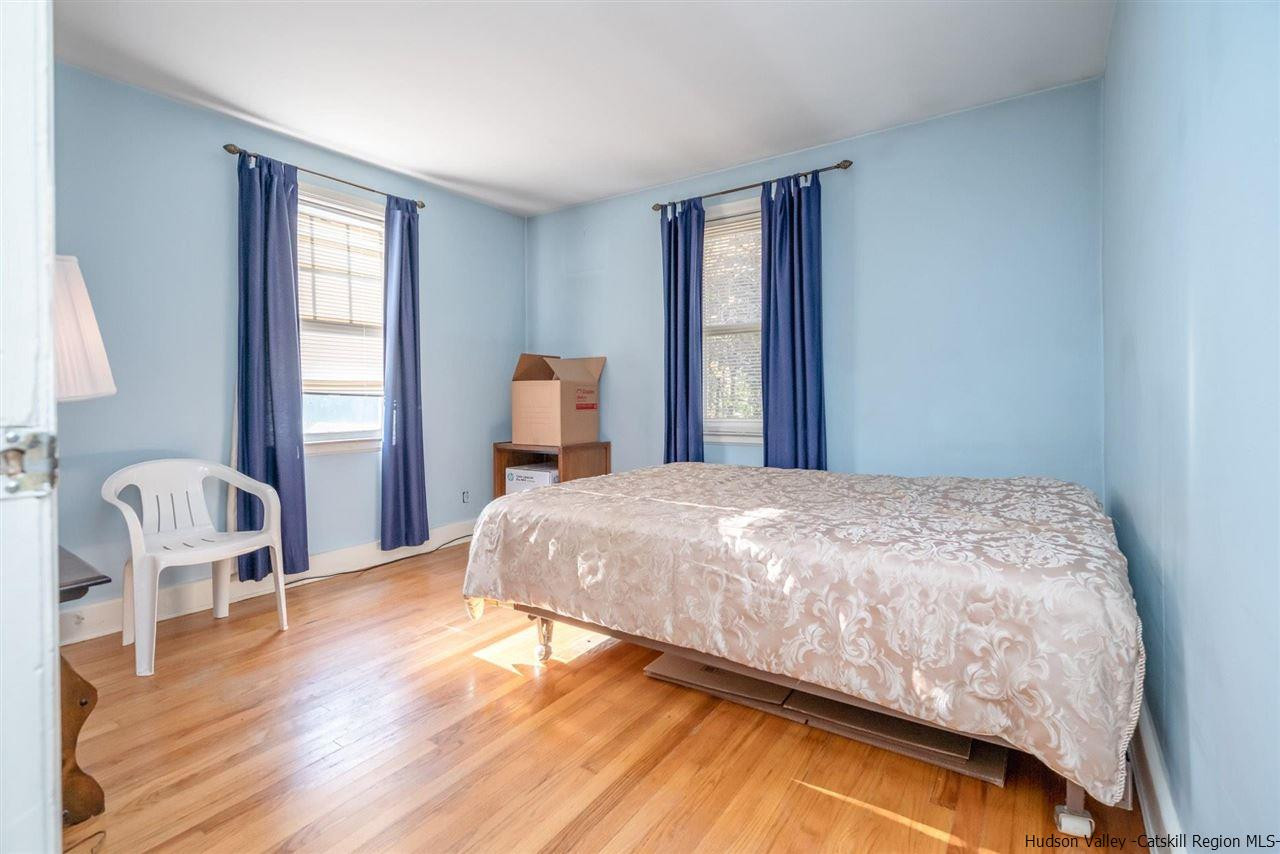 1034 Pine Place Kingston, NY 12401 - Photo 12 of 22 a bedroom with a bed chair and window