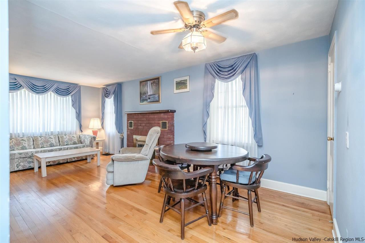 1034 Pine Place Kingston, NY 12401 - Photo 7 of 22 a view of a dining room with furniture window and wooden floor