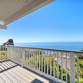 a view of balcony with wooden floor