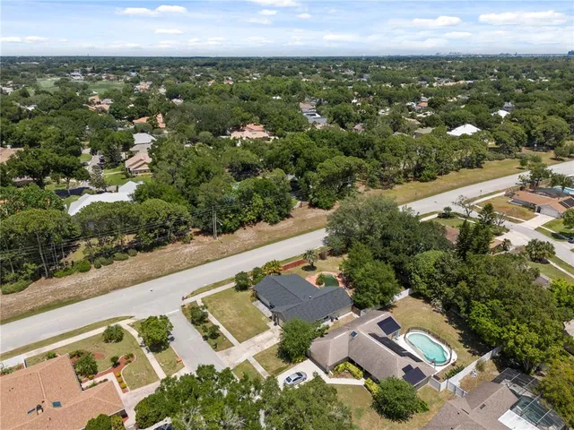 a front view of house with yard and trees
