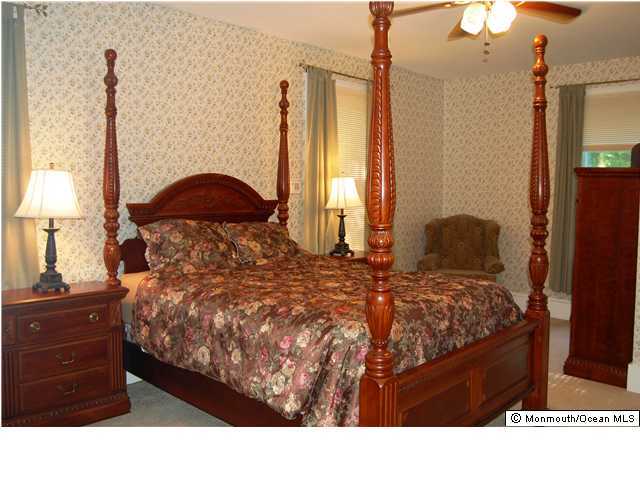 90 Aberdeen Road Matawan, NJ 07747 - Photo 3 of 3 a bedroom with a bed window and a lamp