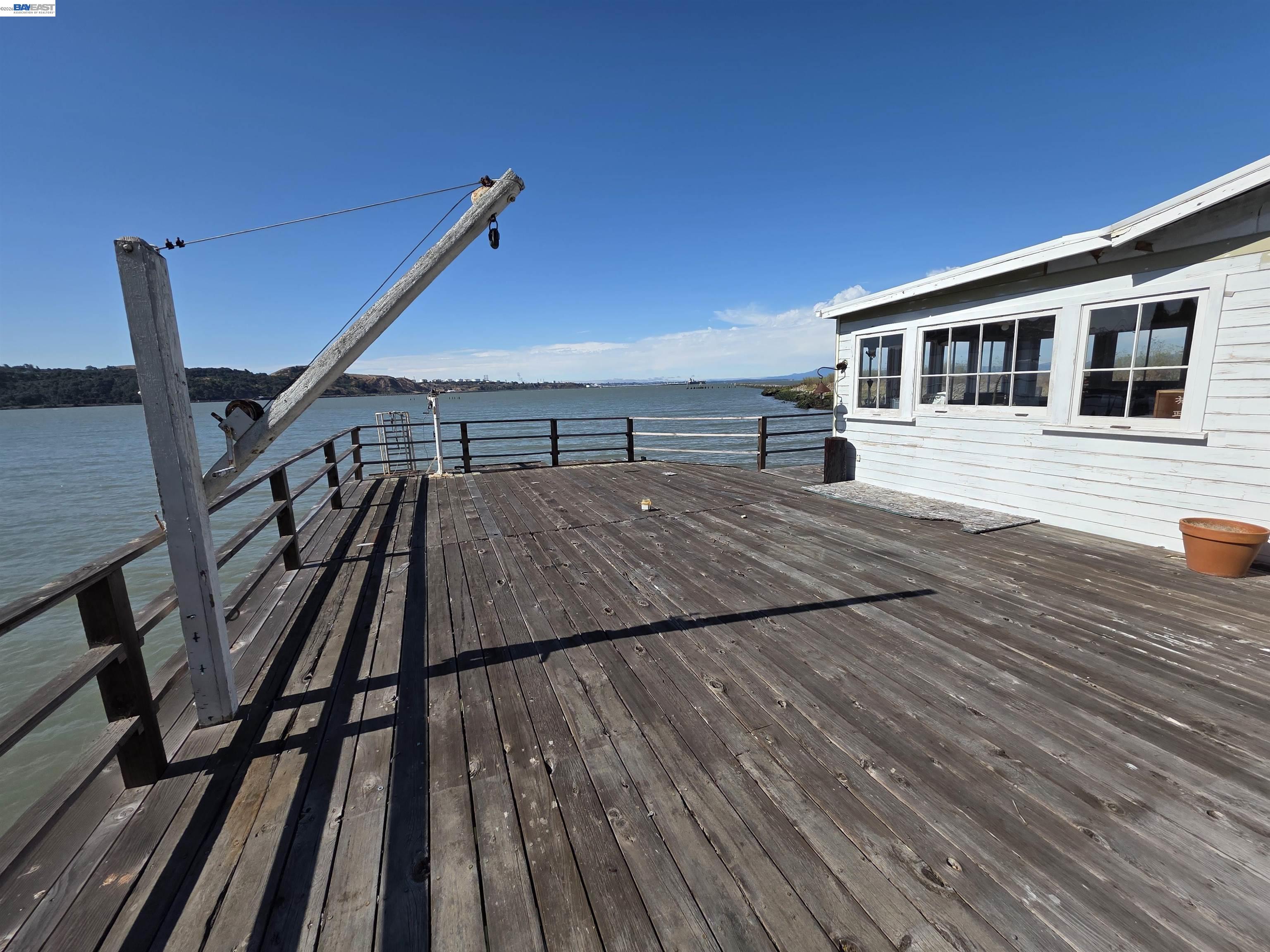 a view of a house with pool and wooden floor